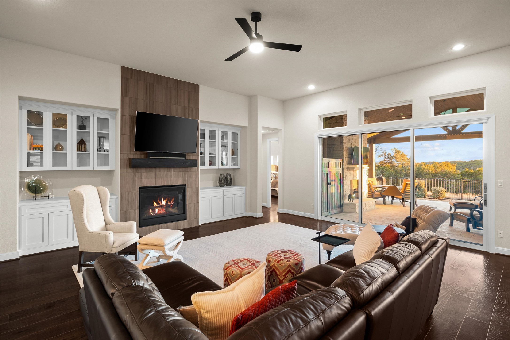 479 Crosswater Lane Dripping Springs, TX 78620 - Photo 10 of 40 a living room with furniture a fireplace and a flat screen tv