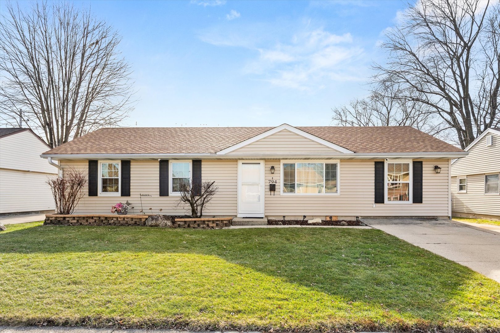 794 Farragut Avenue Romeoville, IL 60446 - Photo 1 of 23 a front view of a house with a garden and lake view