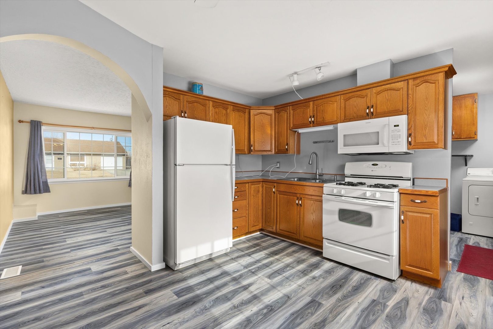 794 Farragut Avenue Romeoville, IL 60446 - Photo 12 of 23 a kitchen with a white stove top oven and refrigerator
