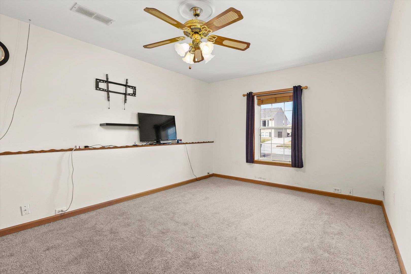 794 Farragut Avenue Romeoville, IL 60446 - Photo 17 of 23 an empty room with windows and fan