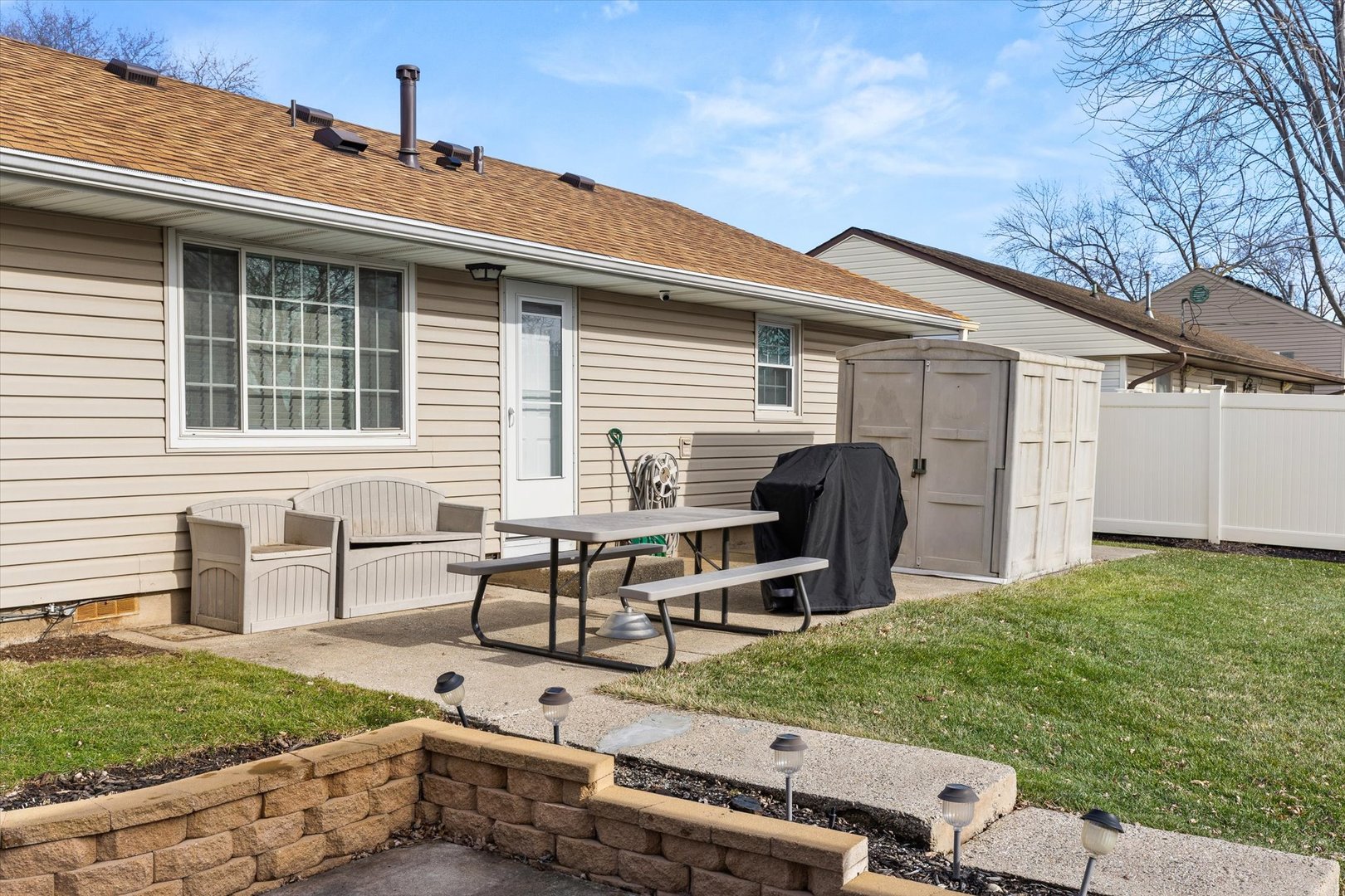 794 Farragut Avenue Romeoville, IL 60446 - Photo 19 of 23 a view of a house with backyard and sitting area