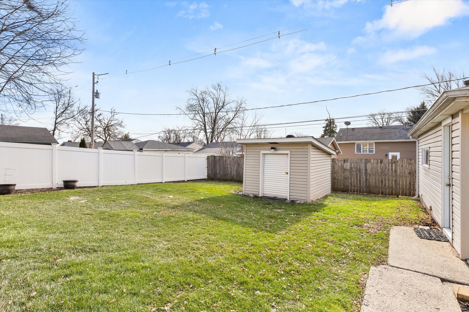 794 Farragut Avenue Romeoville, IL 60446 - Photo 20 of 23 a view of a backyard with a garden