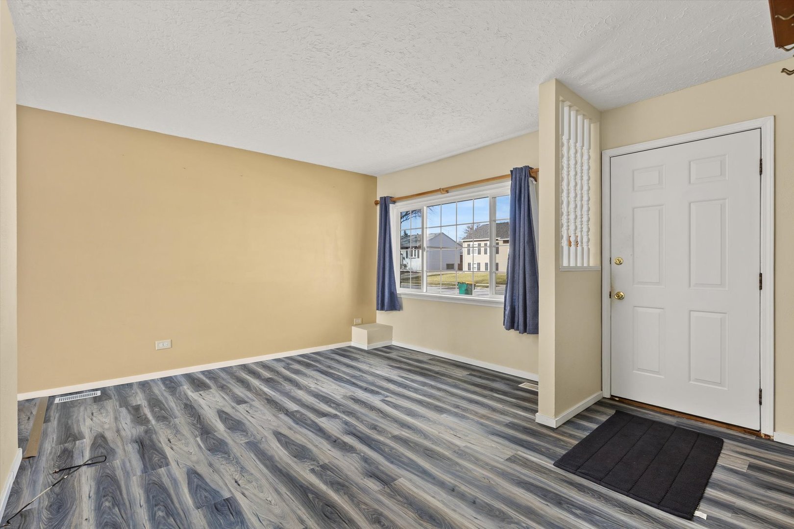 794 Farragut Avenue Romeoville, IL 60446 - Photo 3 of 23 a view of a room with wooden floor and a hallway