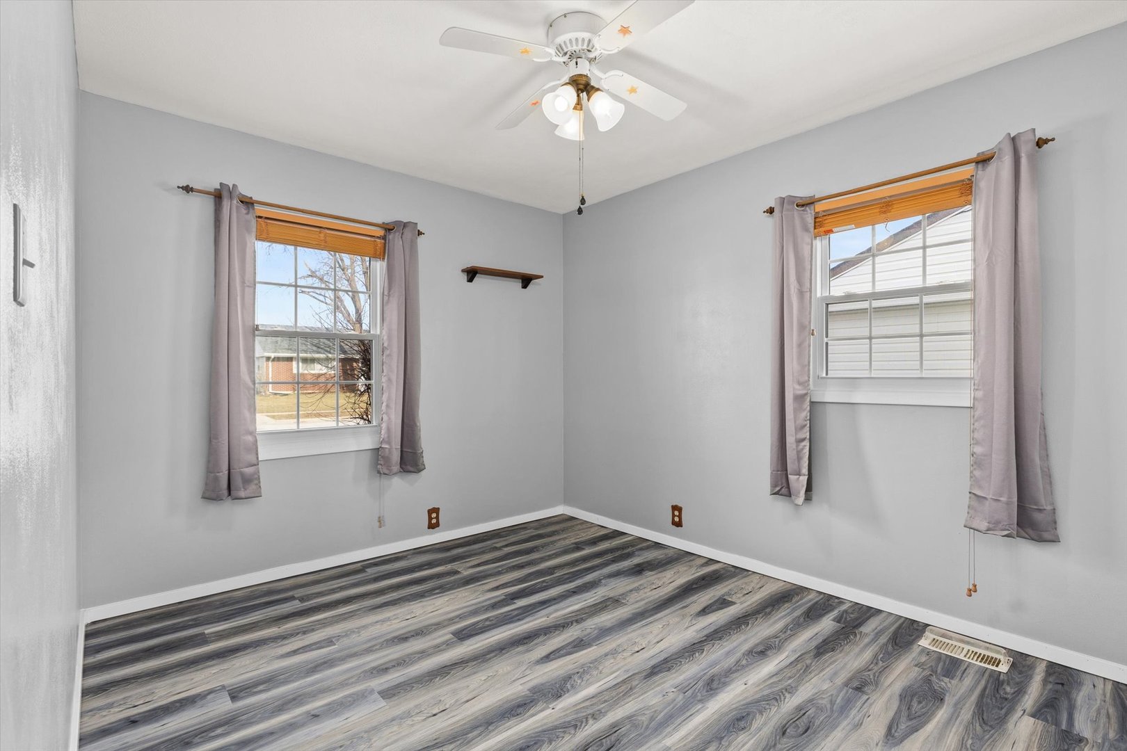 794 Farragut Avenue Romeoville, IL 60446 - Photo 7 of 23 a view of empty room with window and ceiling fan