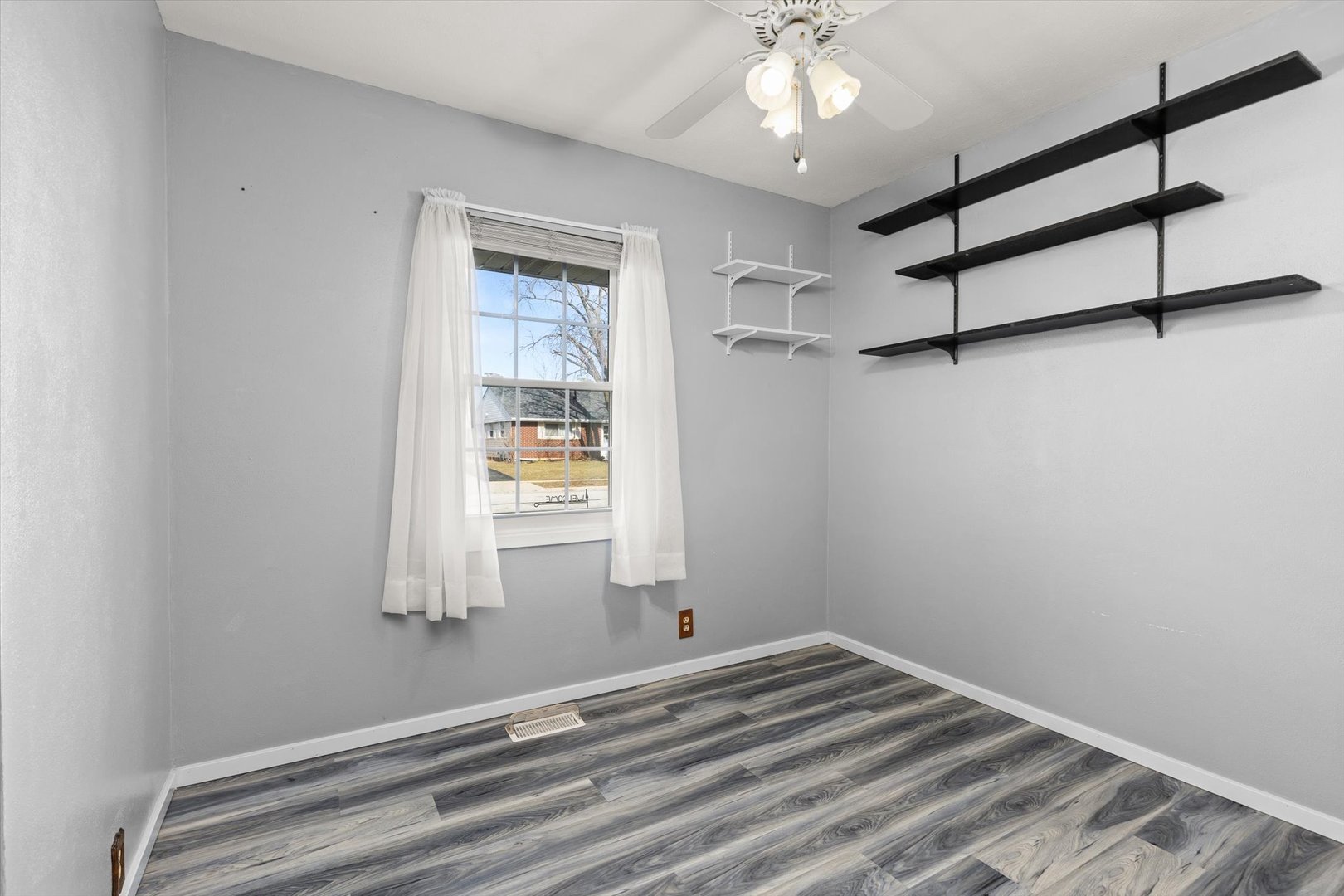 794 Farragut Avenue Romeoville, IL 60446 - Photo 8 of 23 a view of empty room with wooden floor and fan