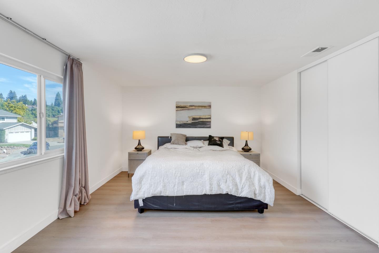 3368 Camarones Place San Ramon, CA 94583 - Photo 15 of 27 a bedroom with a bed and wooden floor