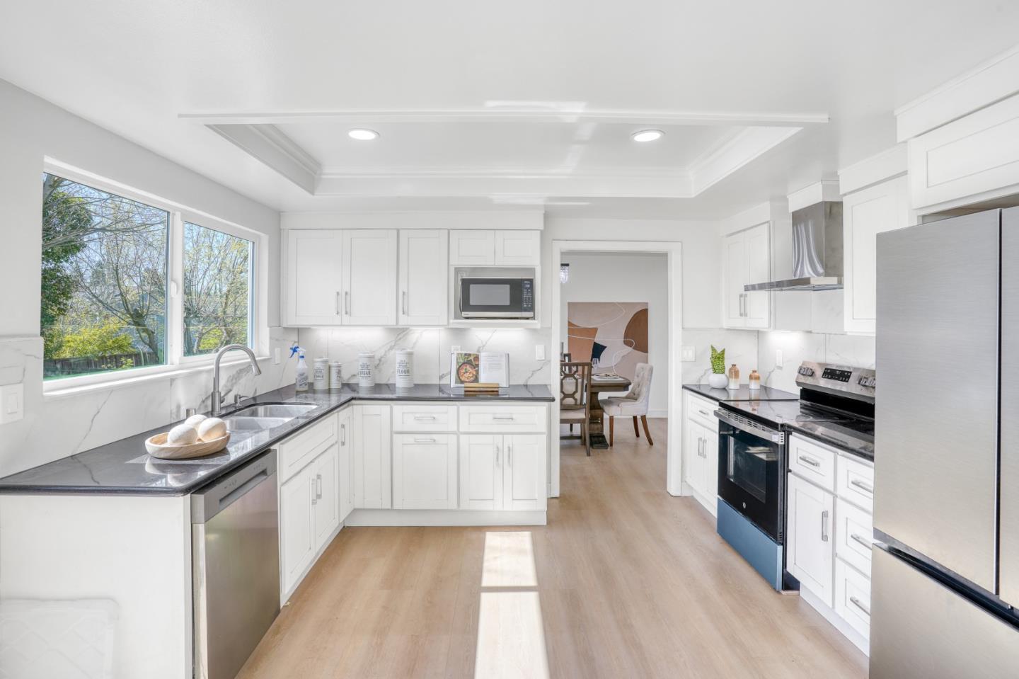 3368 Camarones Place San Ramon, CA 94583 - Photo 5 of 27 a kitchen with granite countertop a sink a counter top space stainless steel appliances and cabinets
