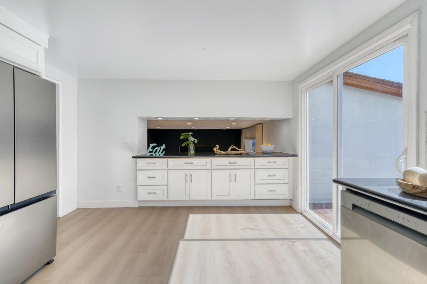 3368 Camarones Place San Ramon, CA 94583 - Photo 6 of 27 a kitchen with white cabinets and stainless steel appliances
