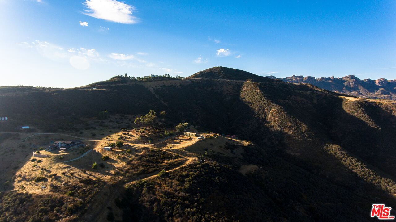 9950 Cotharin Road Malibu, CA 90265 - Photo 33 of 48 a view of a sunset