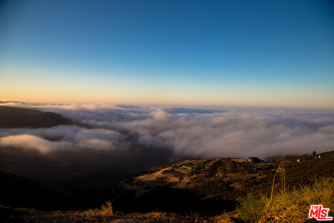 9950 Cotharin Road Malibu, CA 90265 - Photo 42 of 48 an aerial view of a house with a yard