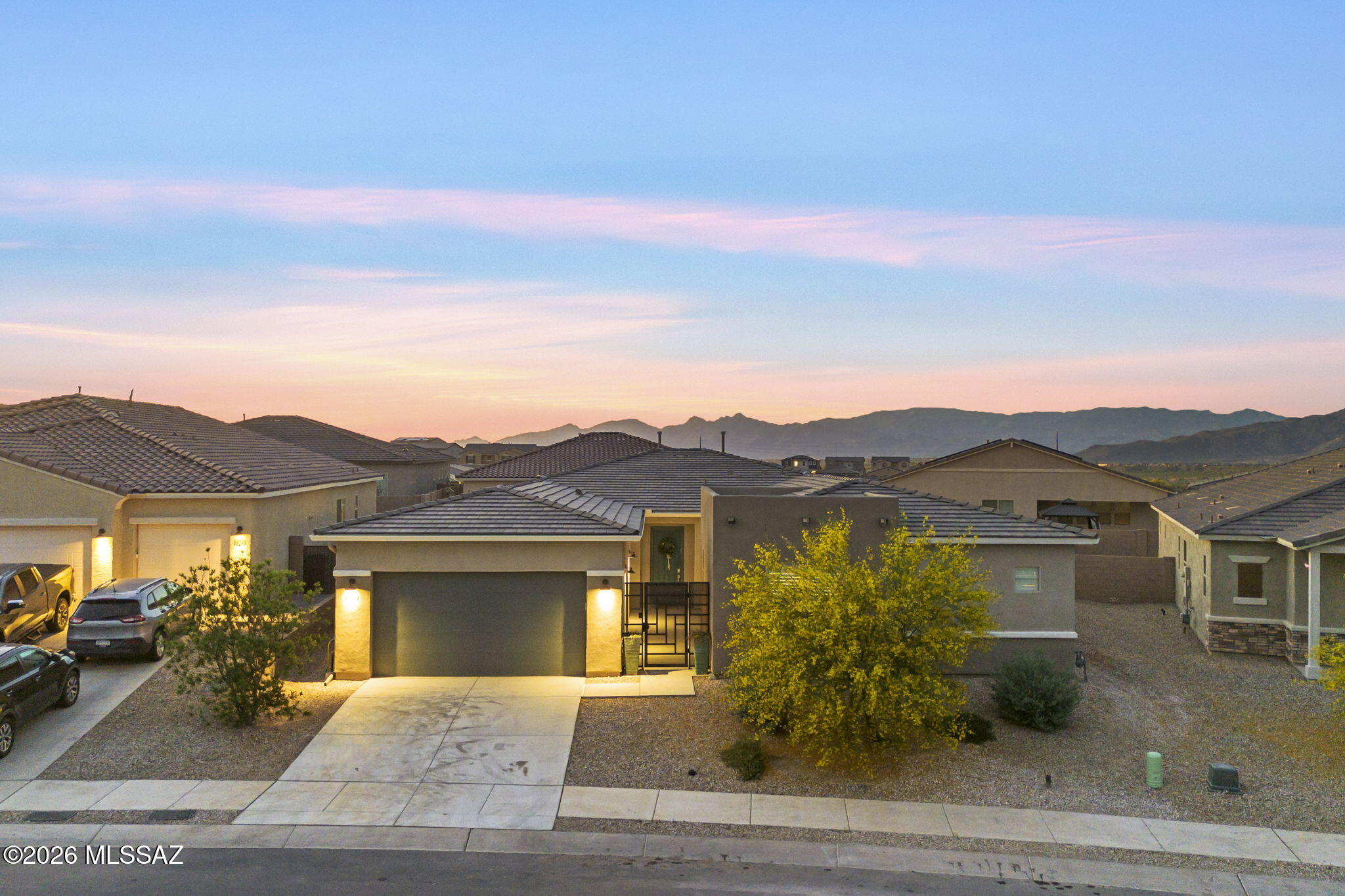 12791 East Tortoise Pointe Drive Vail, AZ 85641 - Photo 2 of 50 front view of a house with a yard