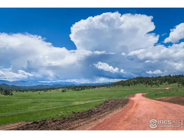 a view of a big yard with a house
