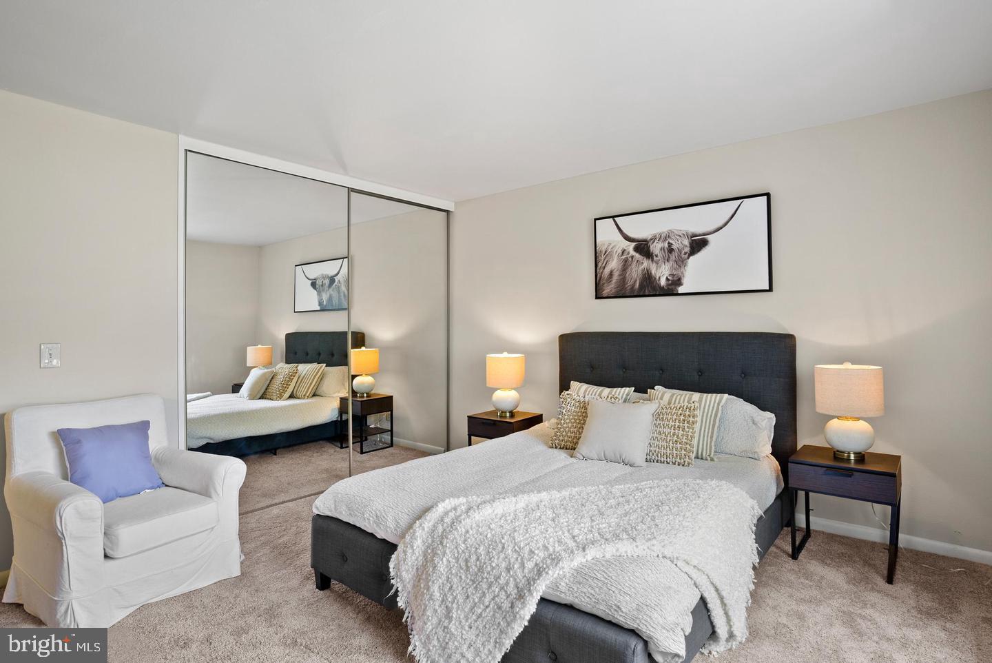 14654 Kelmscot Drive, Unit 236B Silver Spring, MD 20906 - Photo 12 of 27 a bedroom with a bed and a couch