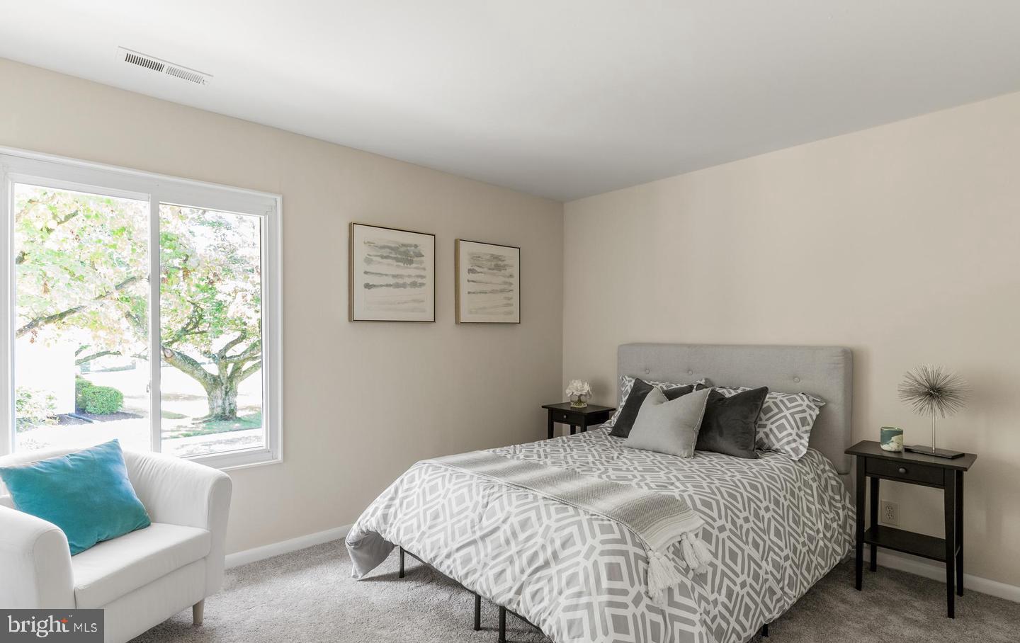 14654 Kelmscot Drive, Unit 236B Silver Spring, MD 20906 - Photo 17 of 27 a bedroom with a bed and window