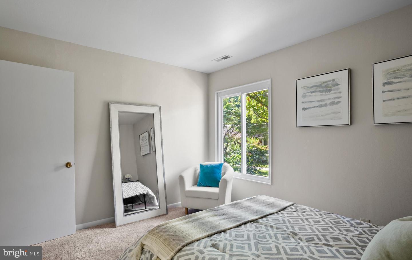 14654 Kelmscot Drive, Unit 236B Silver Spring, MD 20906 - Photo 18 of 27 a bedroom with a bed and a window