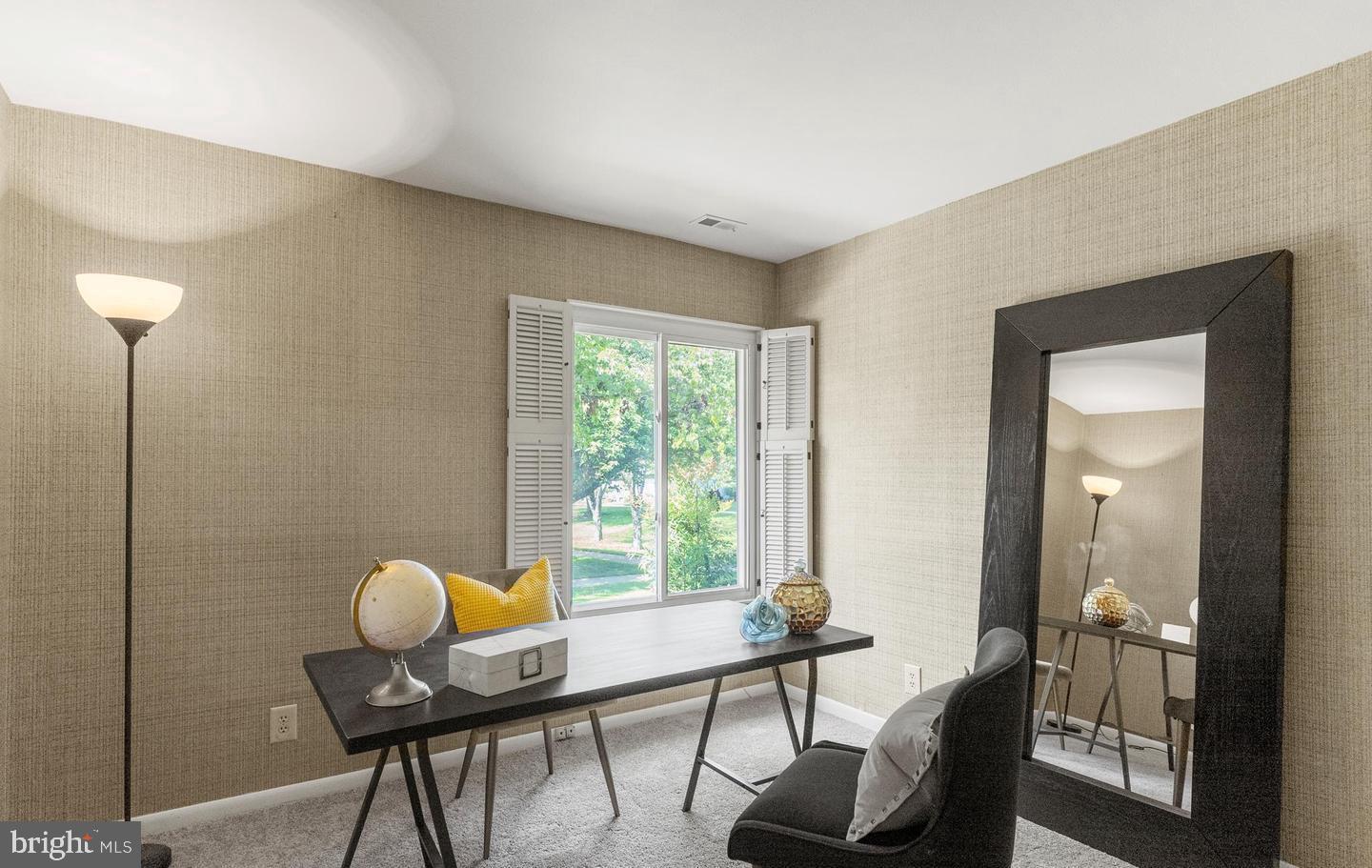 14654 Kelmscot Drive, Unit 236B Silver Spring, MD 20906 - Photo 20 of 27 a view of a workspace room with furniture and wooden floor