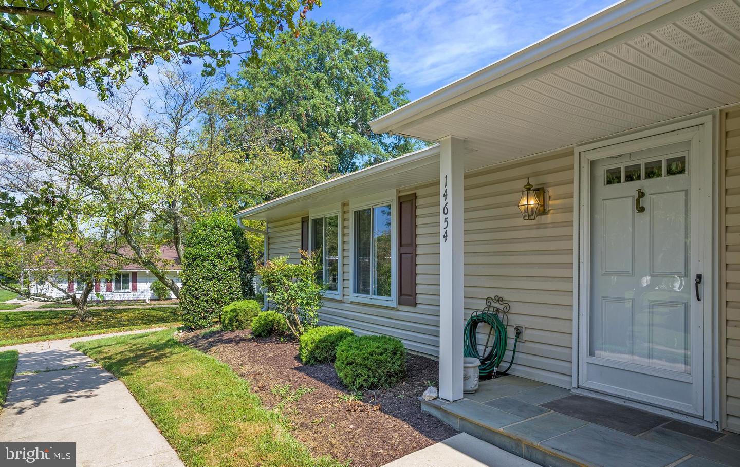 14654 Kelmscot Drive, Unit 236B Silver Spring, MD 20906 - Photo 2 of 27 a house with a tree in front of it