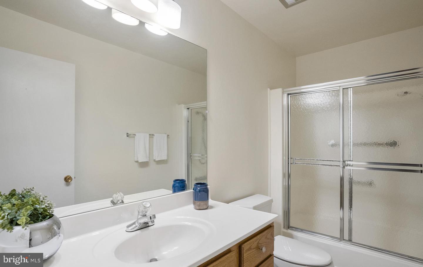 14654 Kelmscot Drive, Unit 236B Silver Spring, MD 20906 - Photo 22 of 27 a bathroom with a sink and a mirror