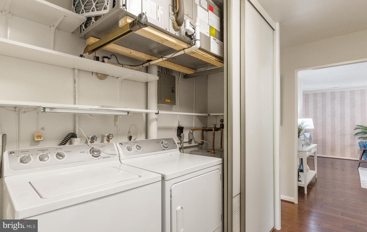 14654 Kelmscot Drive, Unit 236B Silver Spring, MD 20906 - Photo 23 of 27 a utility room with dryer and washer