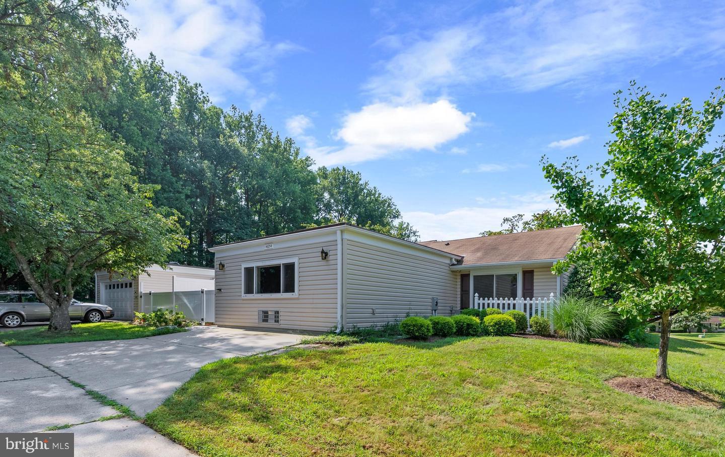 14654 Kelmscot Drive, Unit 236B Silver Spring, MD 20906 - Photo 24 of 27 a front view of a house with a yard