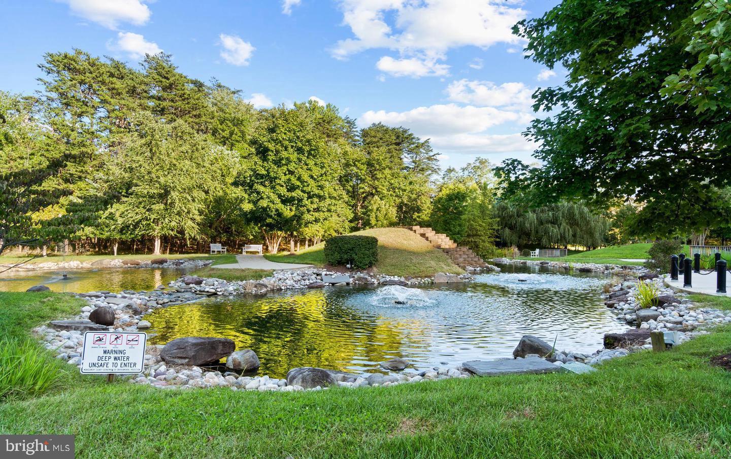 14654 Kelmscot Drive, Unit 236B Silver Spring, MD 20906 - Photo 25 of 27 a swimming pool with outdoor seating and yard