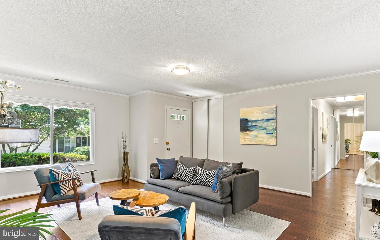 14654 Kelmscot Drive, Unit 236B Silver Spring, MD 20906 - Photo 3 of 27 a living room with furniture and a large window