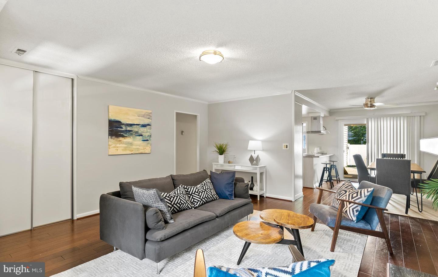 14654 Kelmscot Drive, Unit 236B Silver Spring, MD 20906 - Photo 5 of 27 a living room with furniture and wooden floor