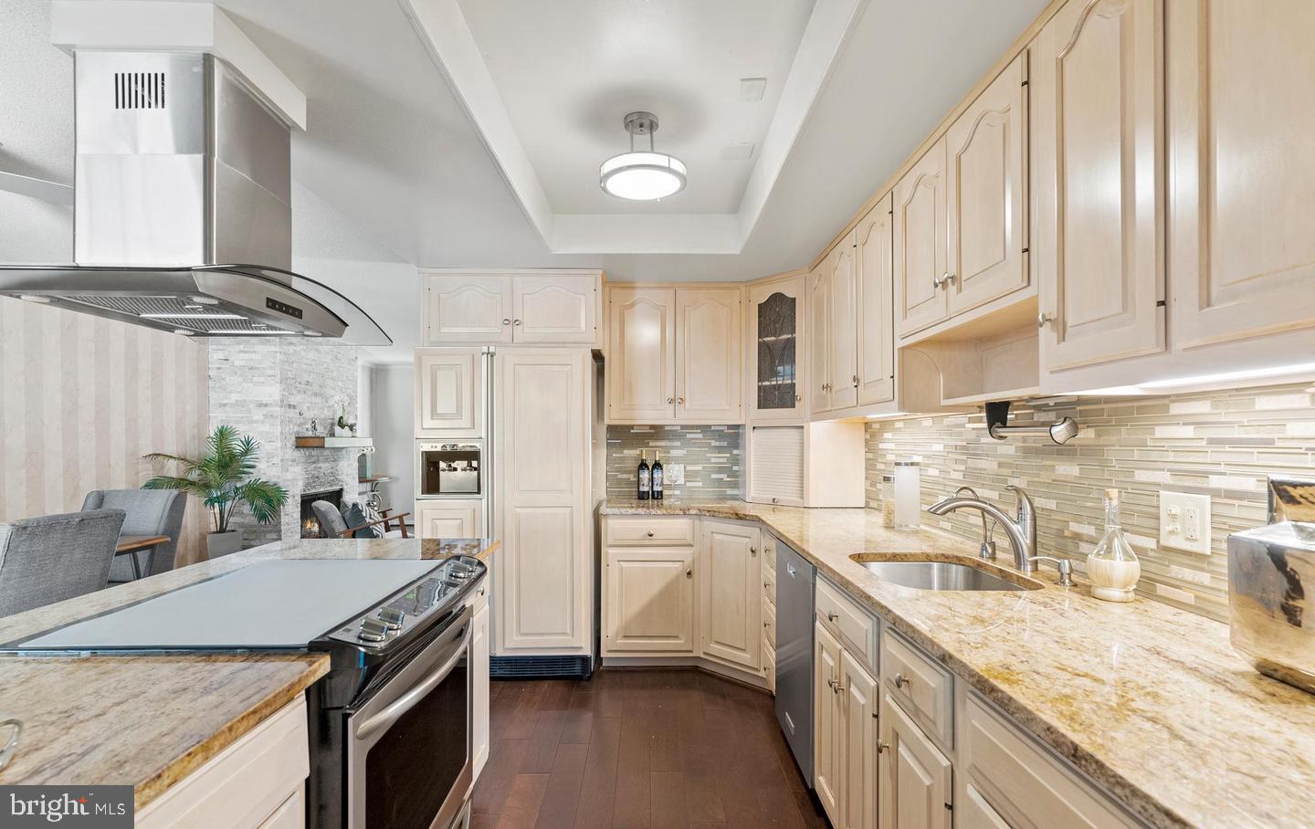 14654 Kelmscot Drive, Unit 236B Silver Spring, MD 20906 - Photo 6 of 27 a kitchen with stainless steel appliances granite countertop a sink stove and refrigerator