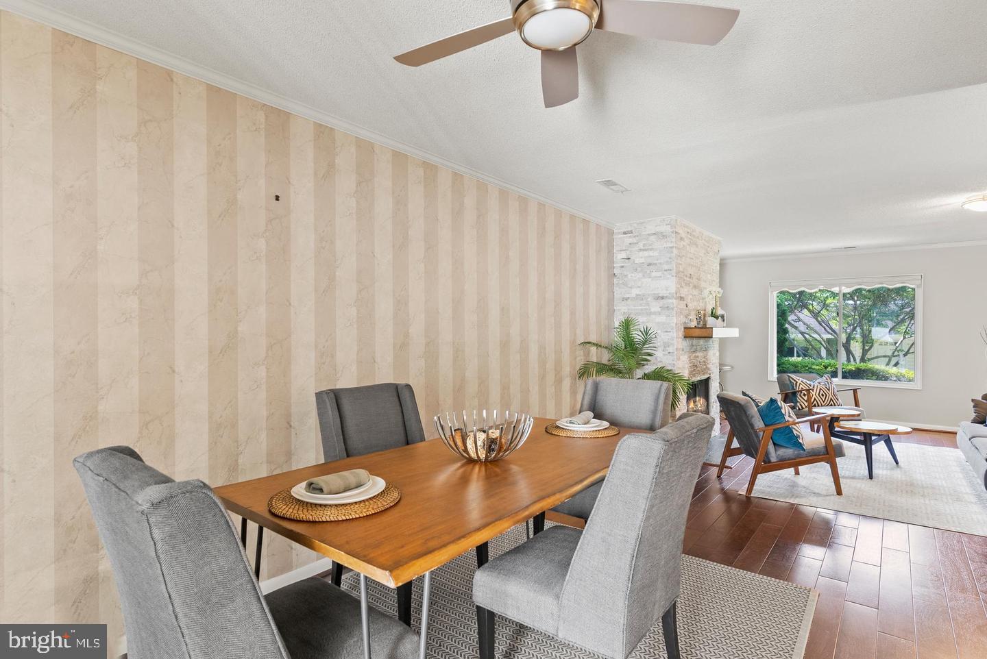 14654 Kelmscot Drive, Unit 236B Silver Spring, MD 20906 - Photo 10 of 27 a view of a dining room with furniture and wooden floor