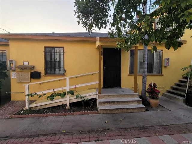 a front view of a house with stairs
