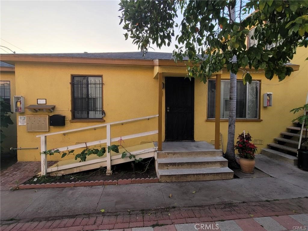 a front view of a house with stairs