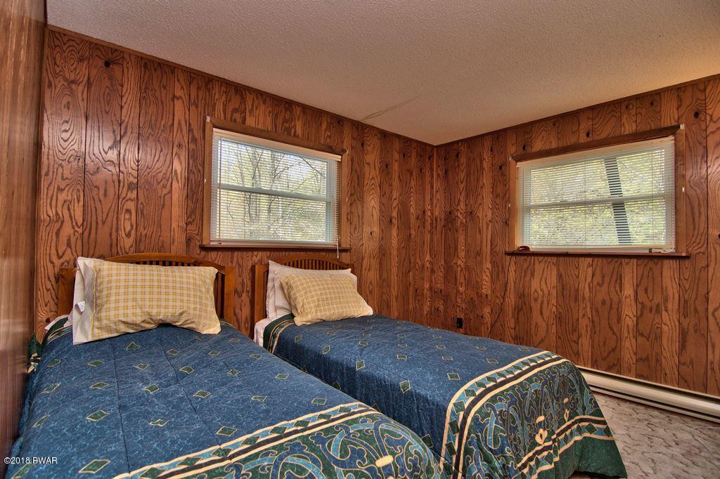 2327 Brookfield Road Lake Ariel, PA 18436 - Photo 28 of 53 a bedroom with two beds and a window