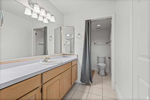 2244 North Canyon Road, Unit 212 Provo, UT 84604 - Photo 17 of 31 Extended vanity with wood-finish cabinetry, white countertop, and integrated sink