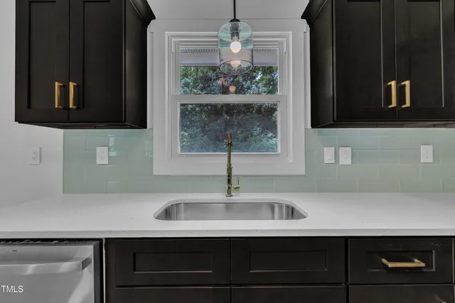 a sink with a sink and mirror