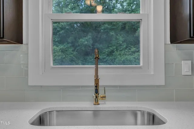 a bathroom with a sink and window