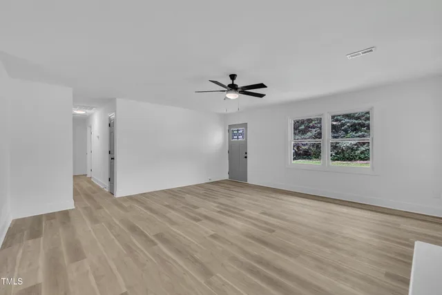 a view of an empty room with a window