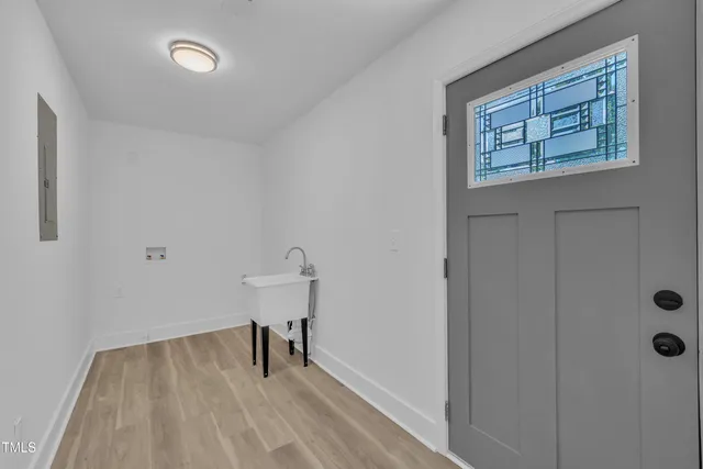 a view of room with window and wooden floor