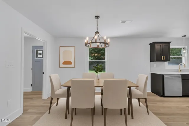 a dining room with furniture window wooden floor