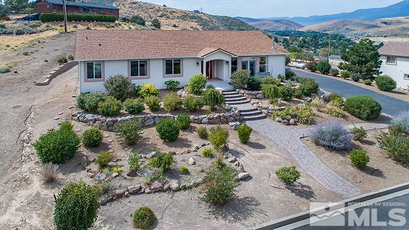 1110 Reese Way Reno, NV 89521 - Photo 1 of 1 an aerial view of a house with a yard