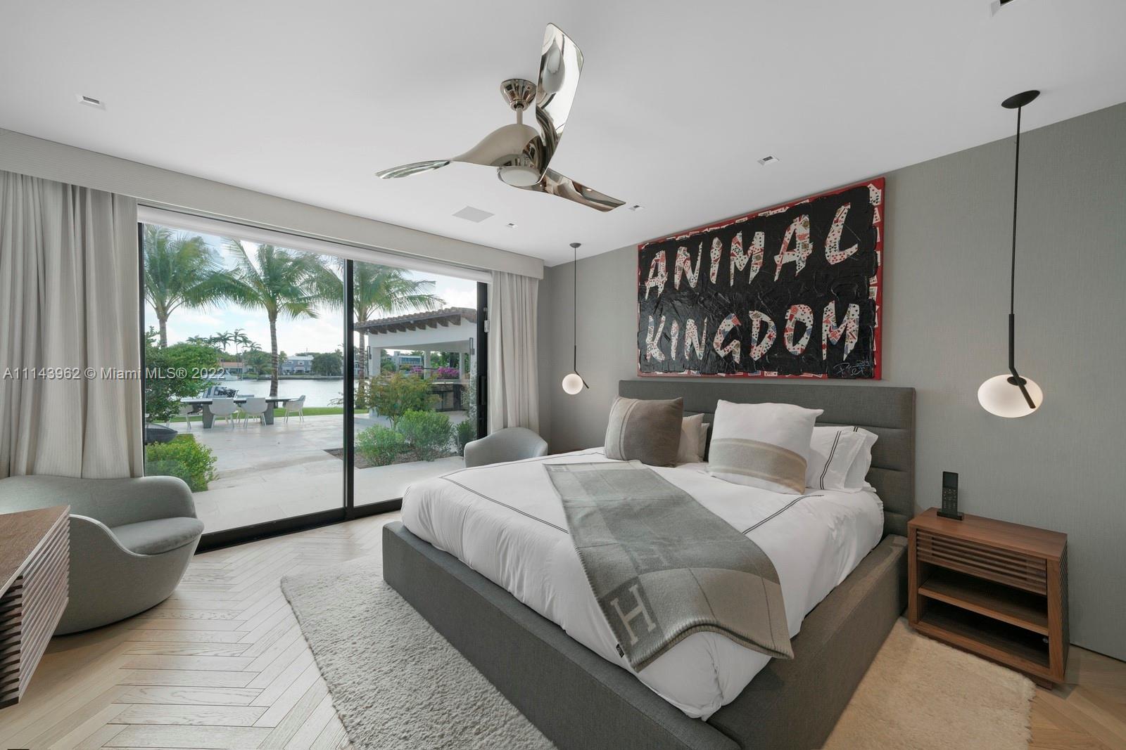 554 Lakeview Drive Miami Beach, FL 33140 - Photo 14 of 20 a bedroom with a large bed and a large window