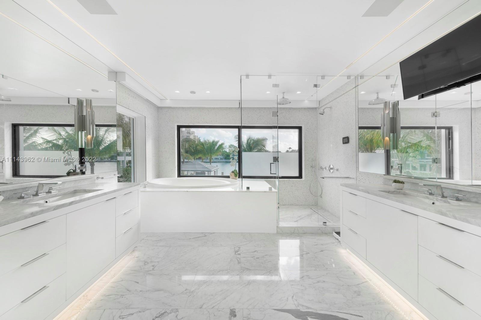 554 Lakeview Drive Miami Beach, FL 33140 - Photo 15 of 20 a large white kitchen with a large window and a sink