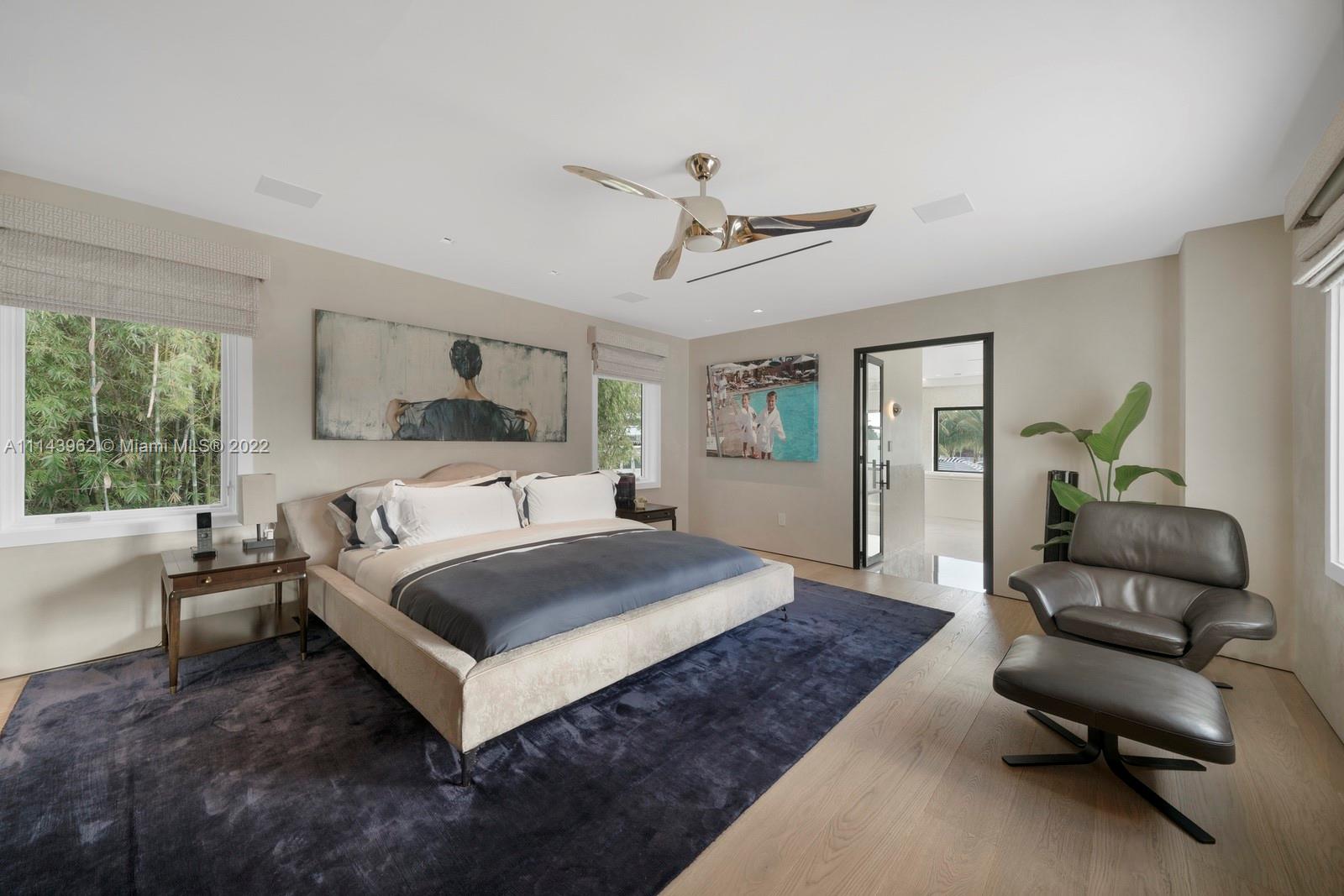 554 Lakeview Drive Miami Beach, FL 33140 - Photo 18 of 20 a living room with a bed furniture and a window
