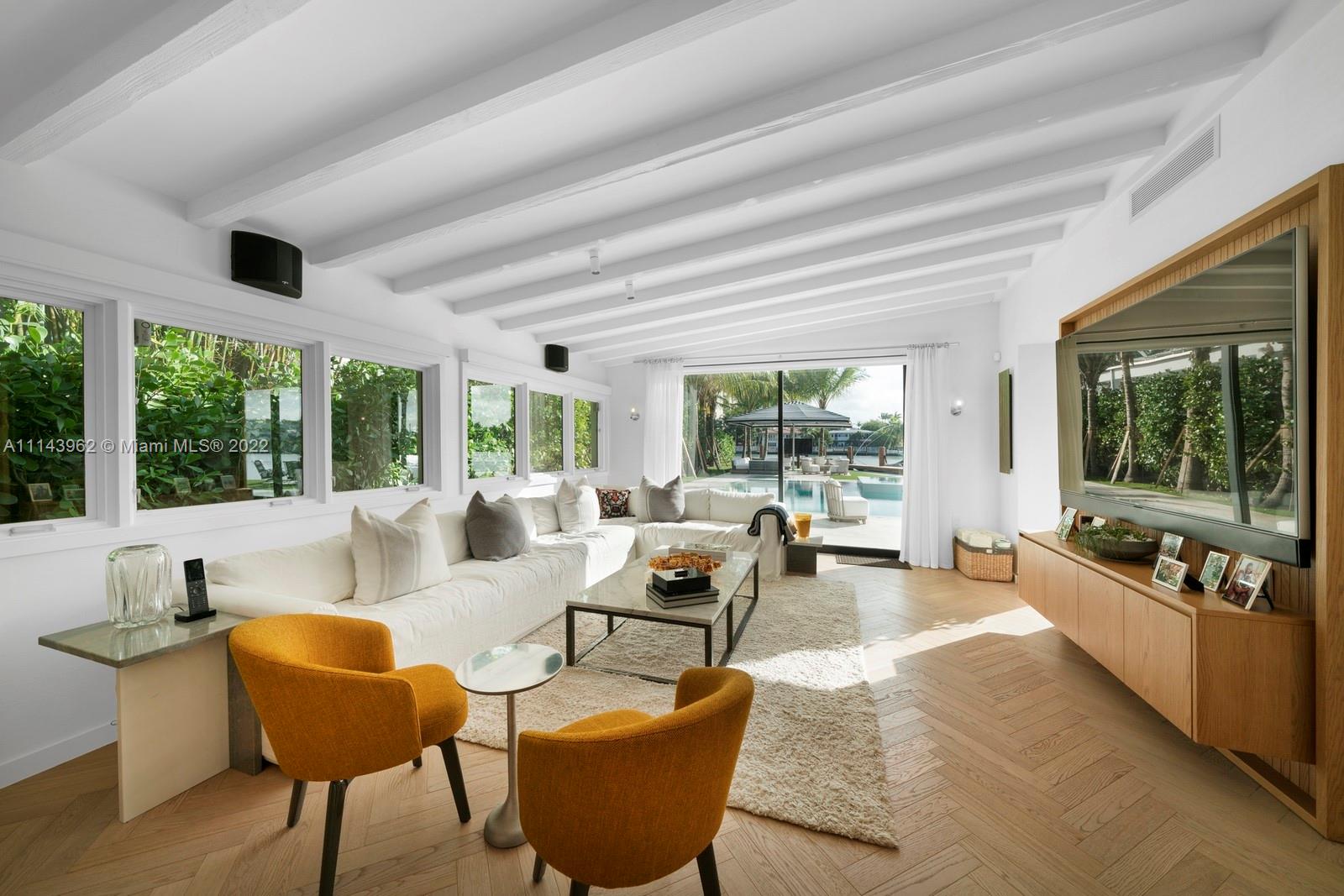 554 Lakeview Drive Miami Beach, FL 33140 - Photo 3 of 20 a living room with furniture and a large window