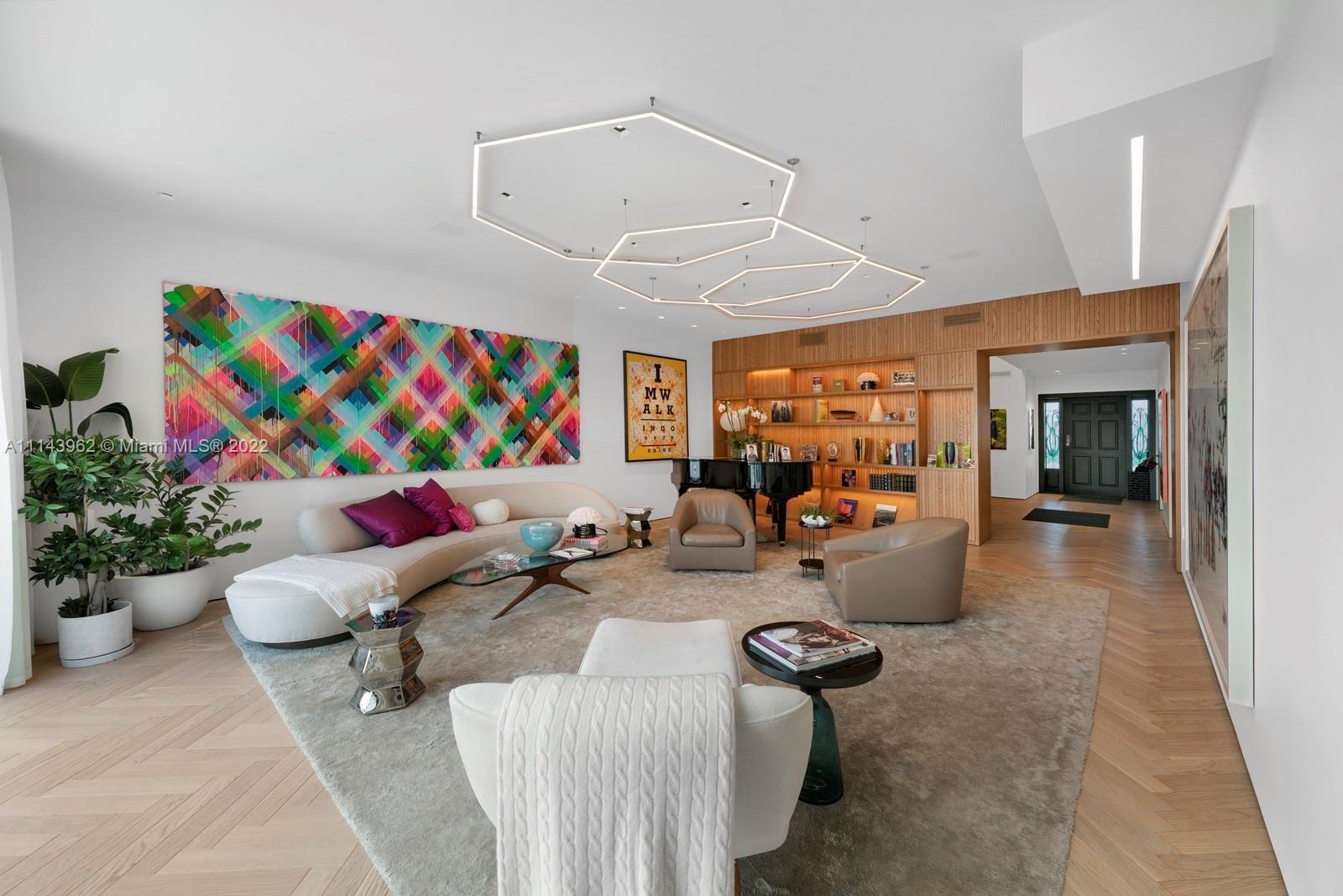 554 Lakeview Drive Miami Beach, FL 33140 - Photo 8 of 20 a living room with furniture and a potted plant