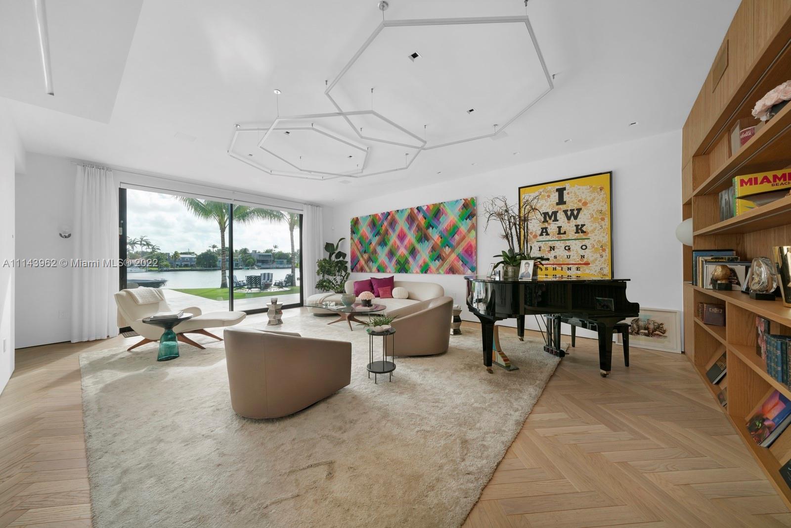 554 Lakeview Drive Miami Beach, FL 33140 - Photo 9 of 20 a living room with furniture and a large window