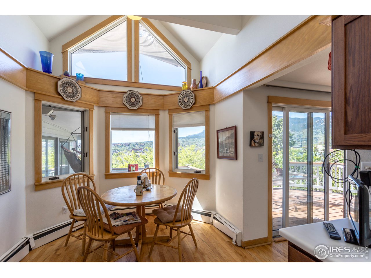 1450 High Street Boulder, CO 80304 - Photo 12 of 25 a view of a dining room with furniture a chandelier and wooden floor