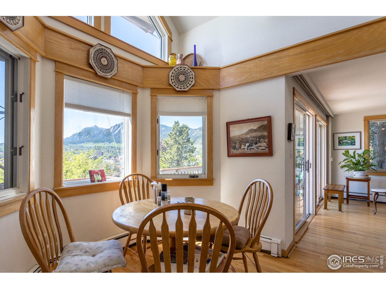 1450 High Street Boulder, CO 80304 - Photo 13 of 25 a view of a dining room with furniture window and wooden floor