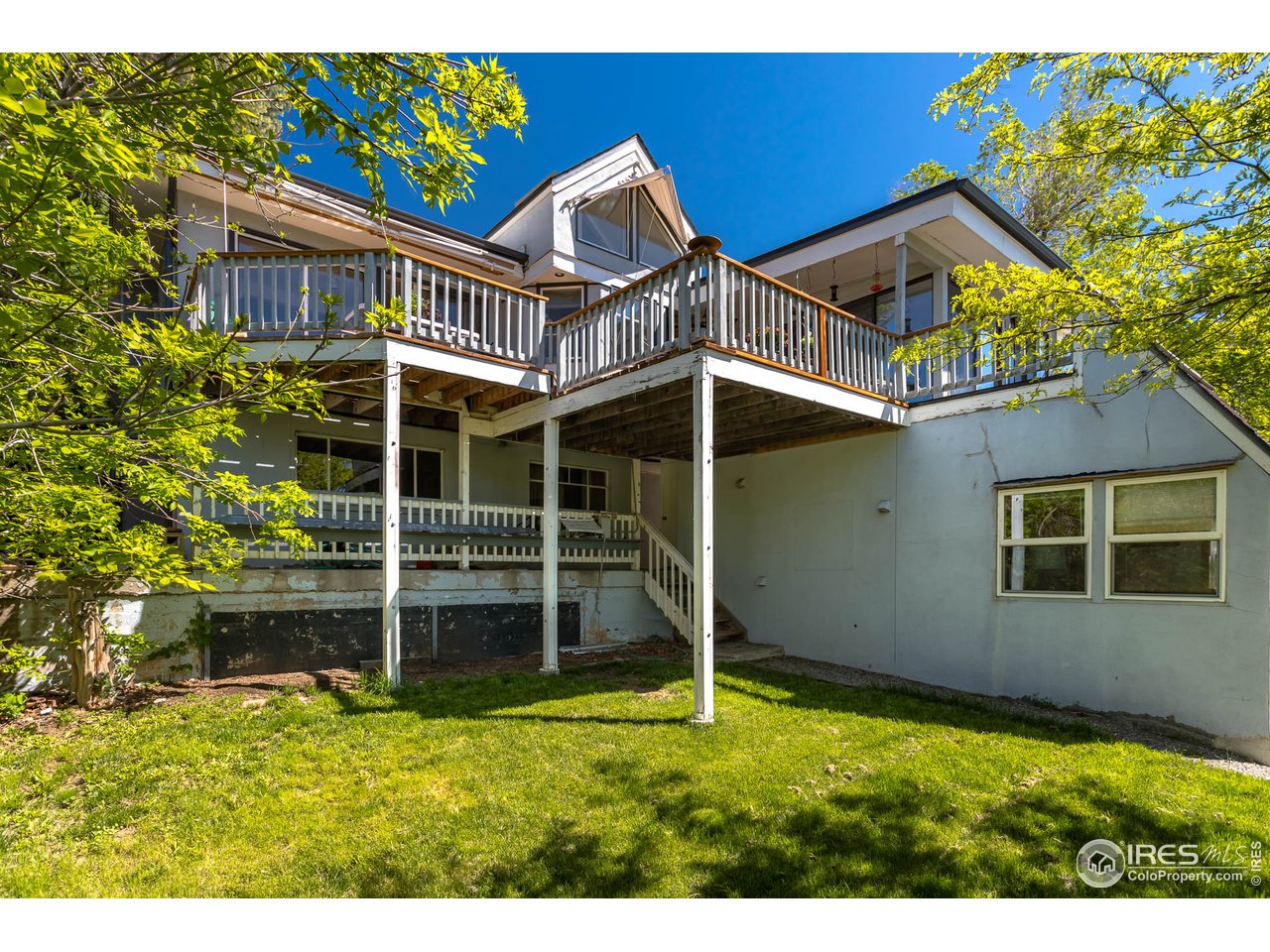1450 High Street Boulder, CO 80304 - Photo 15 of 25 a view of a house with a yard and sitting area