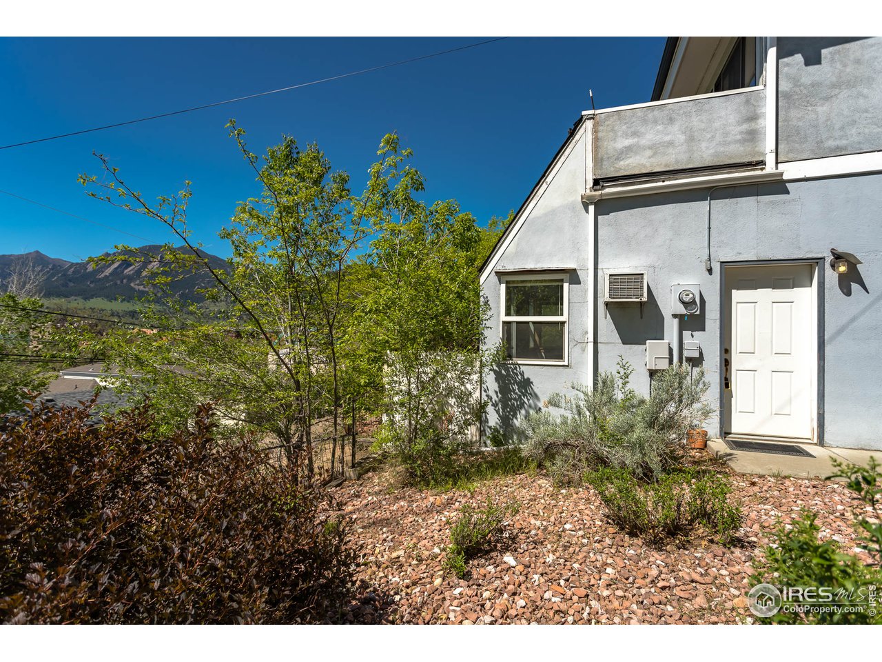1450 High Street Boulder, CO 80304 - Photo 18 of 25 a view of a house with a backyard