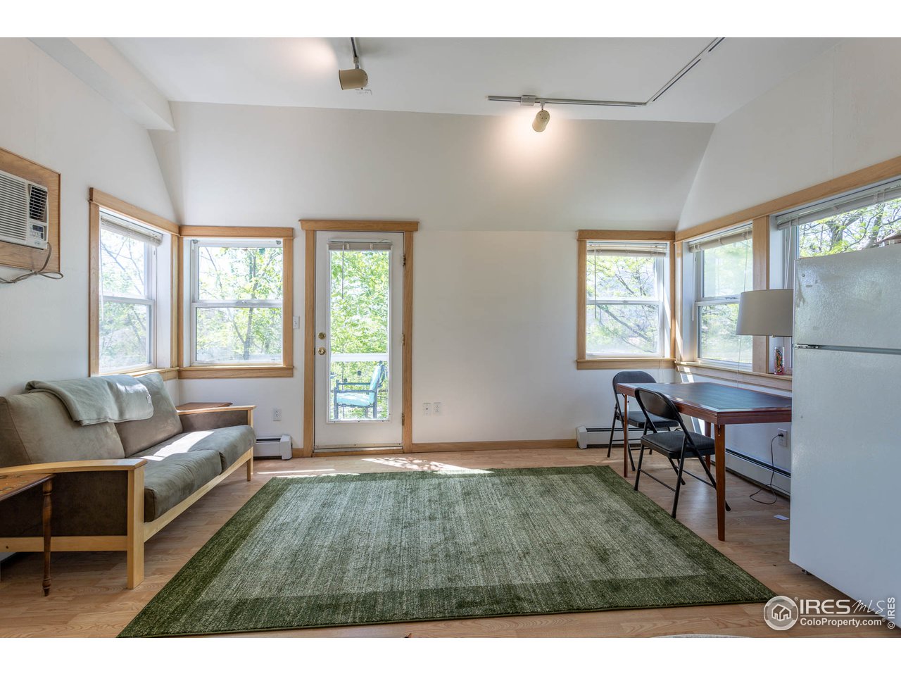 1450 High Street Boulder, CO 80304 - Photo 20 of 25 a living room with furniture and a window